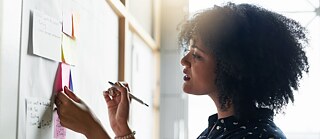 Woman working at a display board